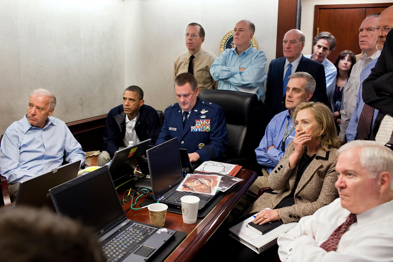 President Barack Obama, Vice President Joe Biden, Secretary of State Hillary Clinton, and members of the national security team including Secretary of Defense Robert Gates, watch updates on the raid against Osama bin Laden in a crowded White House Situation Room conference room on May 1, 2011