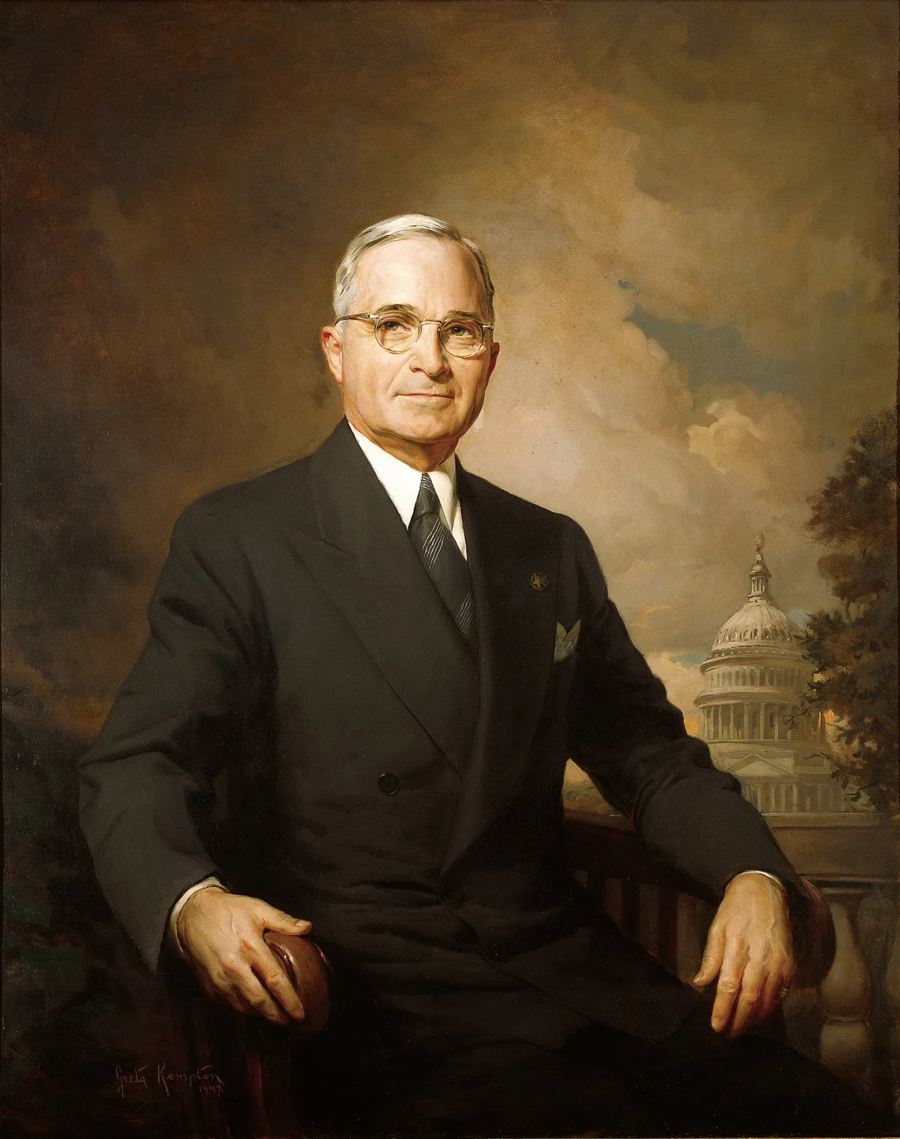 Official 1947 White House portrait of President Harry Truman, seated with the U.S. Capitol visible in the background