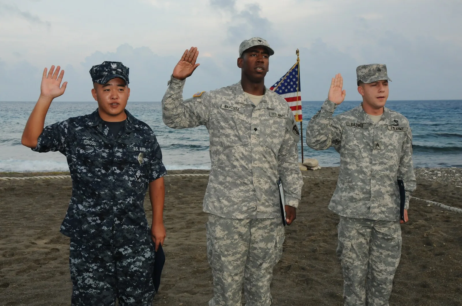 Service members take the Oath of Allegiance at a naturalization ceremony