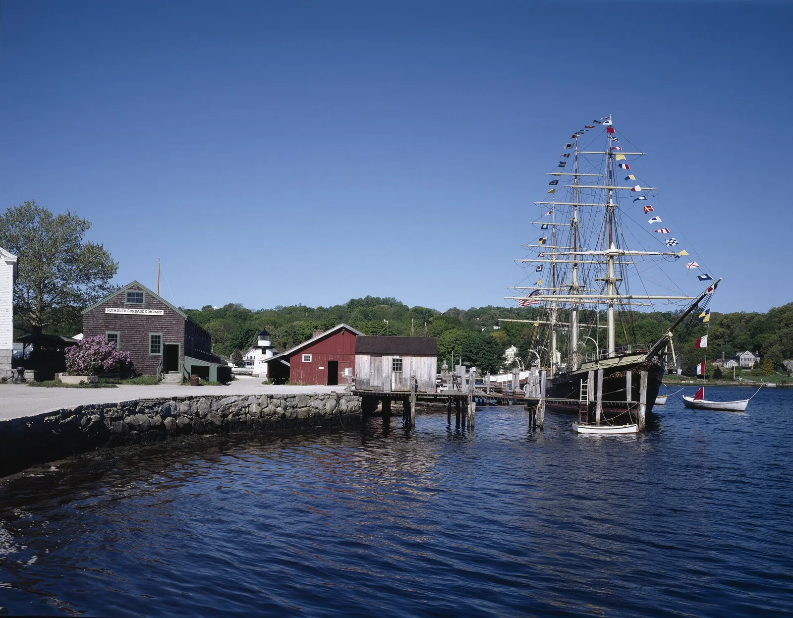 Mystic Seaport Museum waterfront with historic sailing vessels on the Mystic River, Connecticut