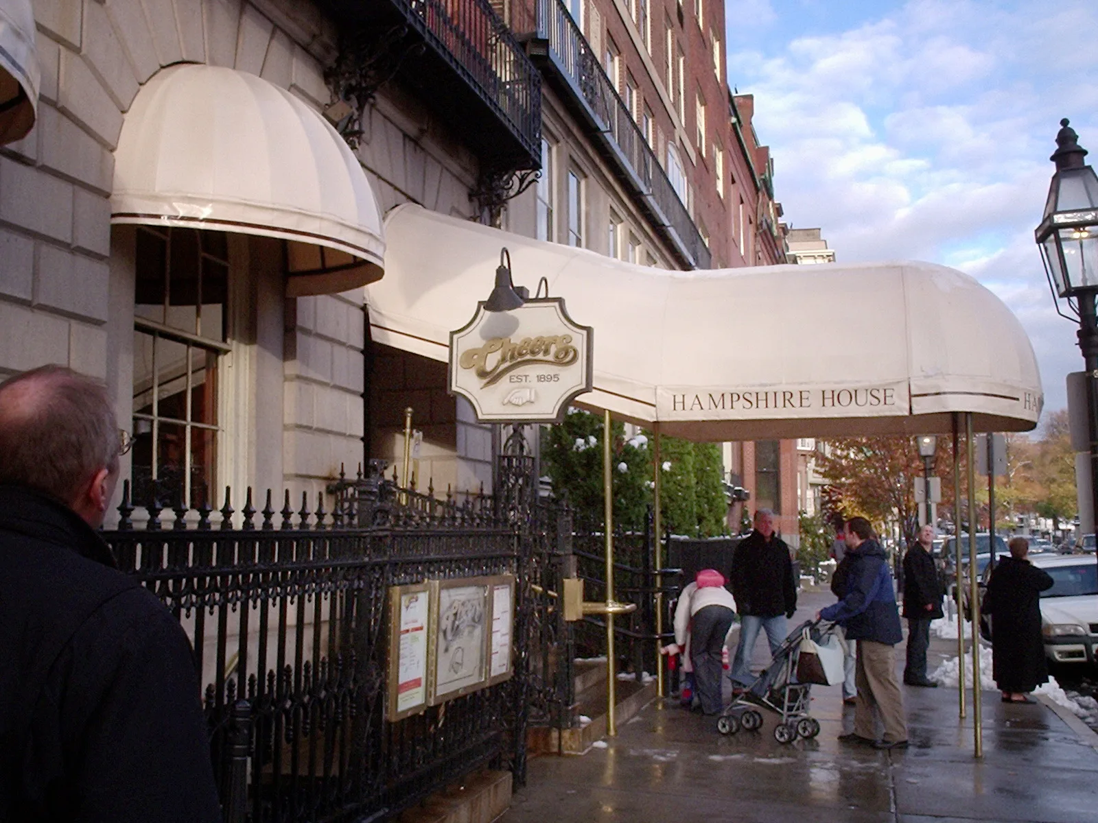 The iconic red awning of the Cheers bar at 84 Beacon Street in Boston's Beacon Hill neighborhood