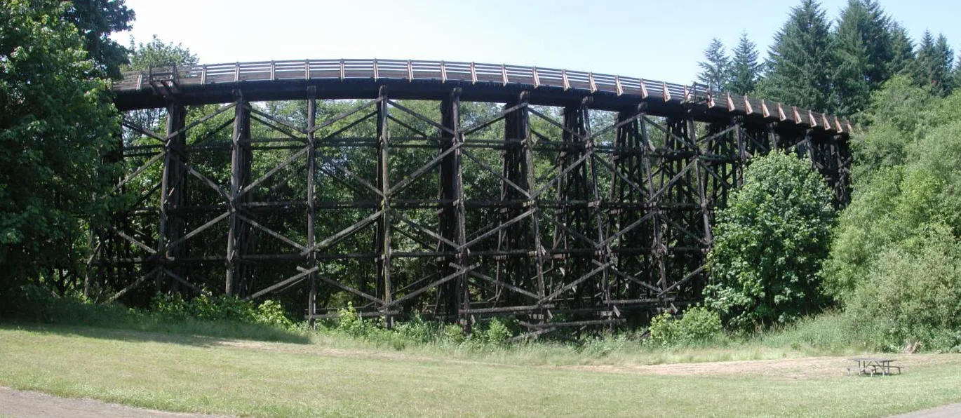 The restored Buxton Trestle, a curving wooden railroad bridge that carries the paved Banks-Vernonia State Trail about 80 feet above Mendenhall Creek
