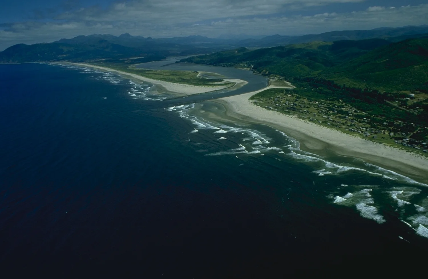 An aerial view of Nehalem Bay on the northern Oregon coast, the estuary and spit near Wheeler where the Salmonberry Trail corridor reaches tidewater