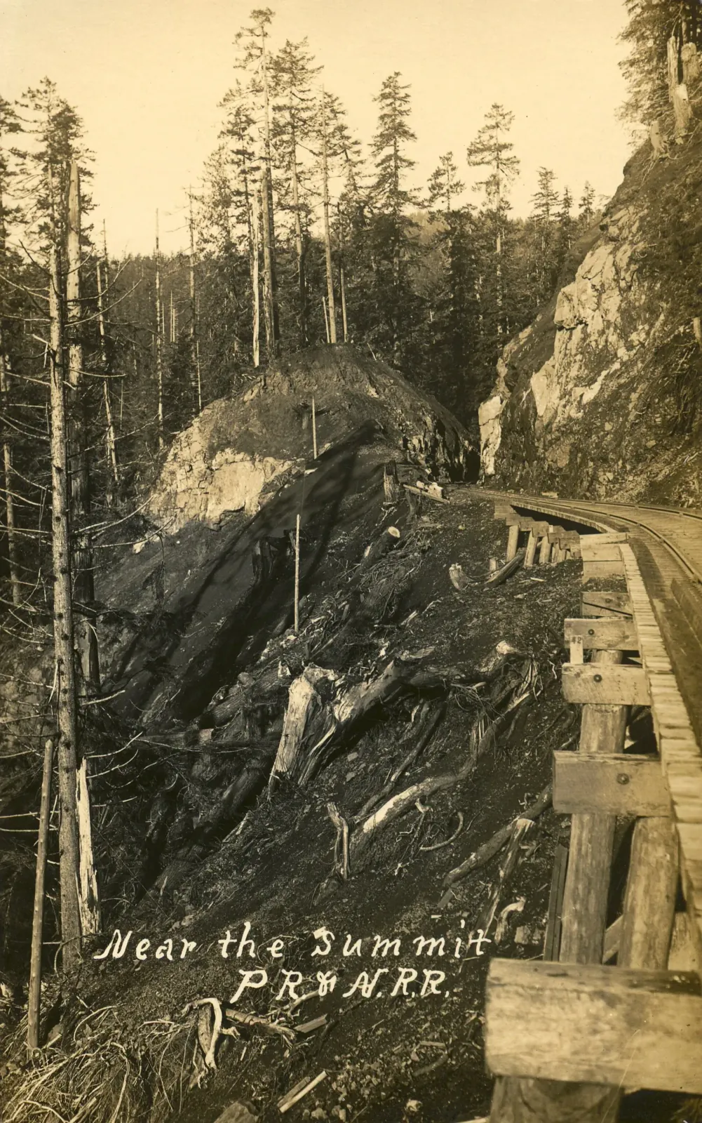 The Pacific Railway & Navigation grade near the summit of the Oregon Coast Range around 1908, the kind of steep, curving mountain alignment that made the line costly to maintain