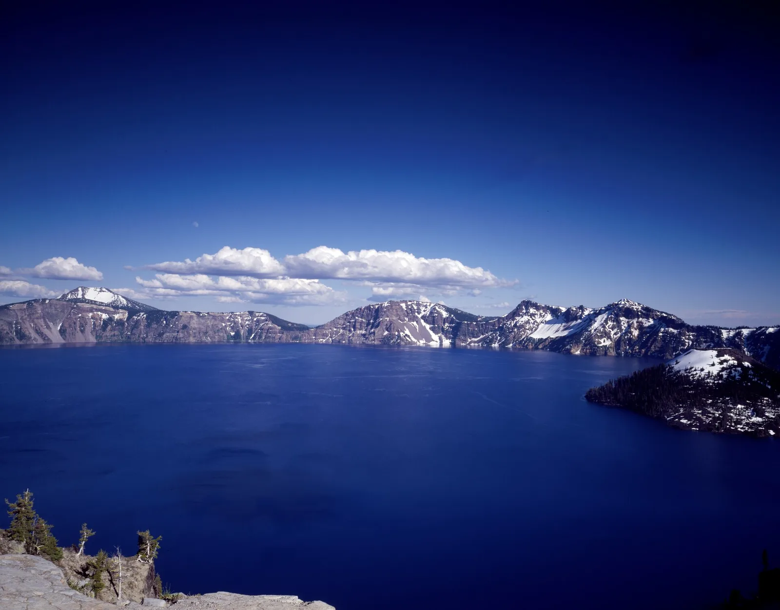 Crater Lake National Park deep blue water and Wizard Island in south-central Oregon
