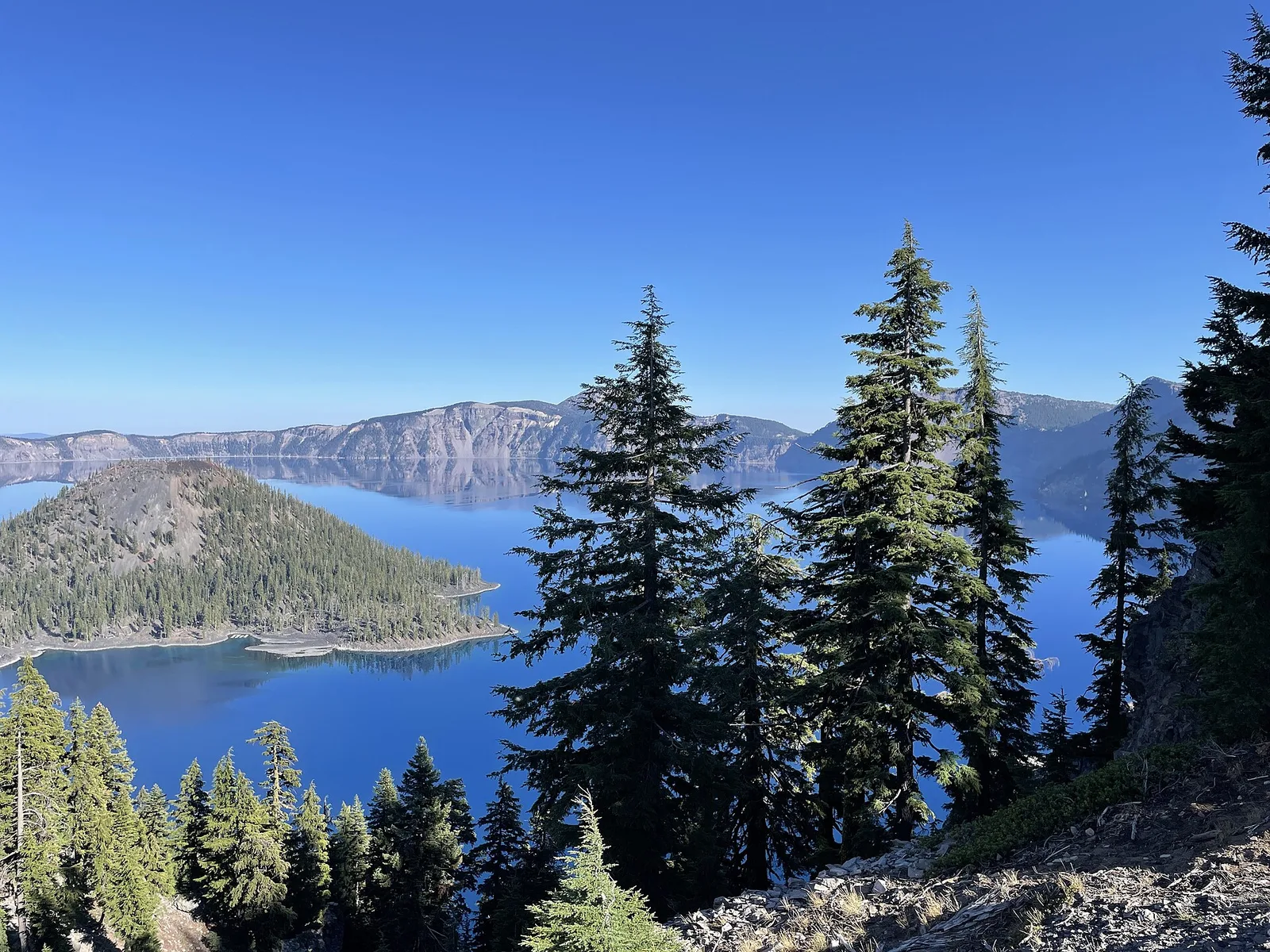 Wizard Island cinder cone rising from the deep blue waters of Crater Lake, Oregon