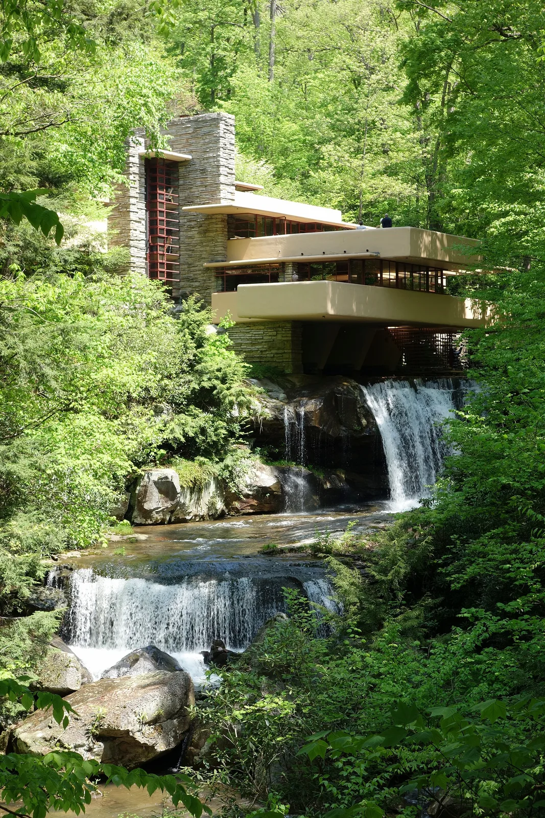 Classic downstream view of Fallingwater cantilevered over Bear Run waterfall in Pennsylvania