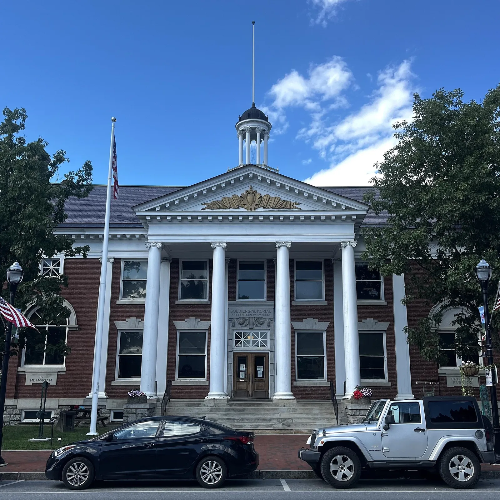 The white-columned Stowe Town Hall with its cupola on Main Street in Stowe, Vermont