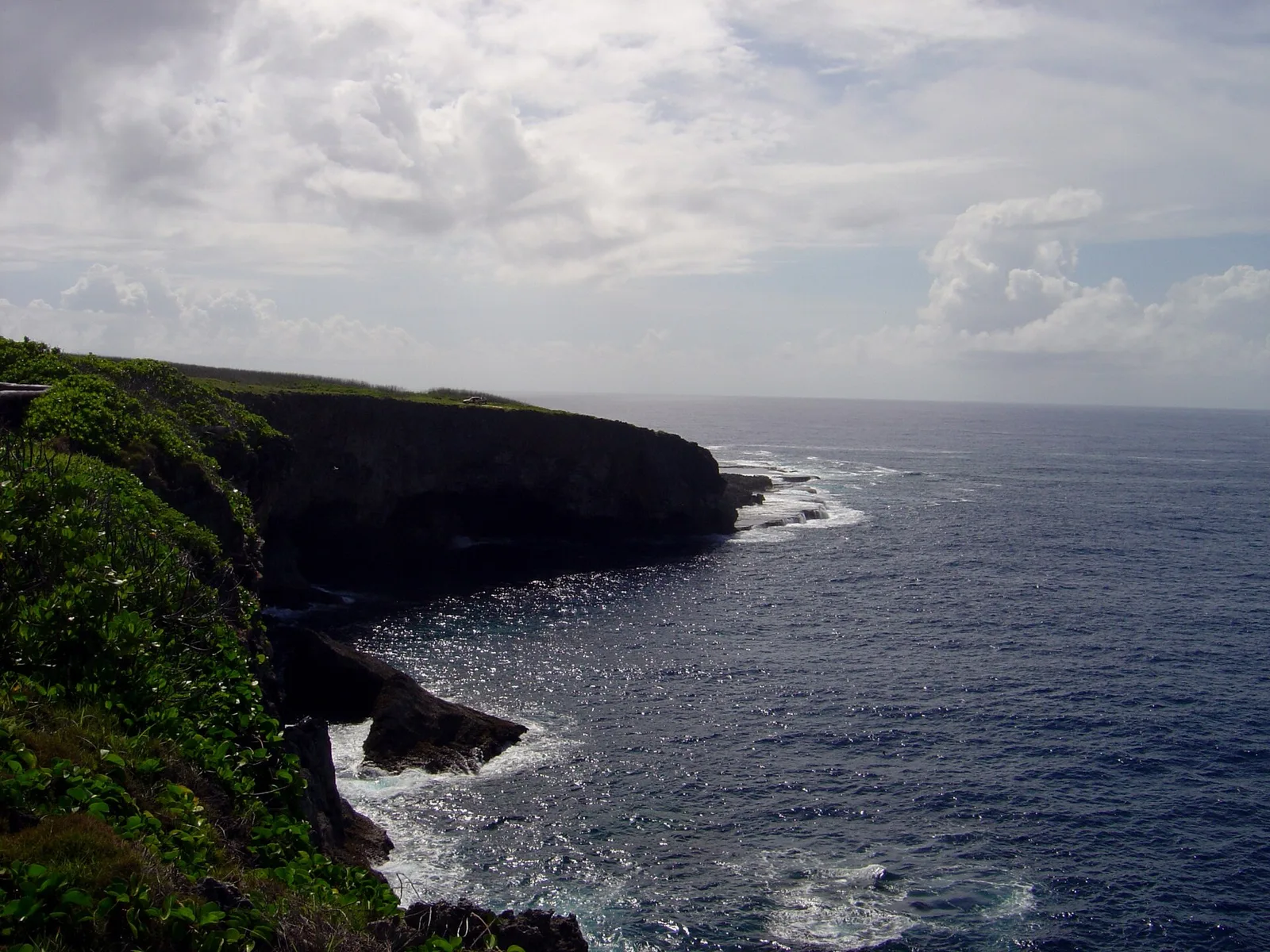 Banzai Cliff on the northern tip of Saipan, Northern Mariana Islands, where thousands of Japanese civilians jumped to their deaths in July 1944 rather than surrender to American forces, one of the most somber WWII memorial sites in U.S. territory